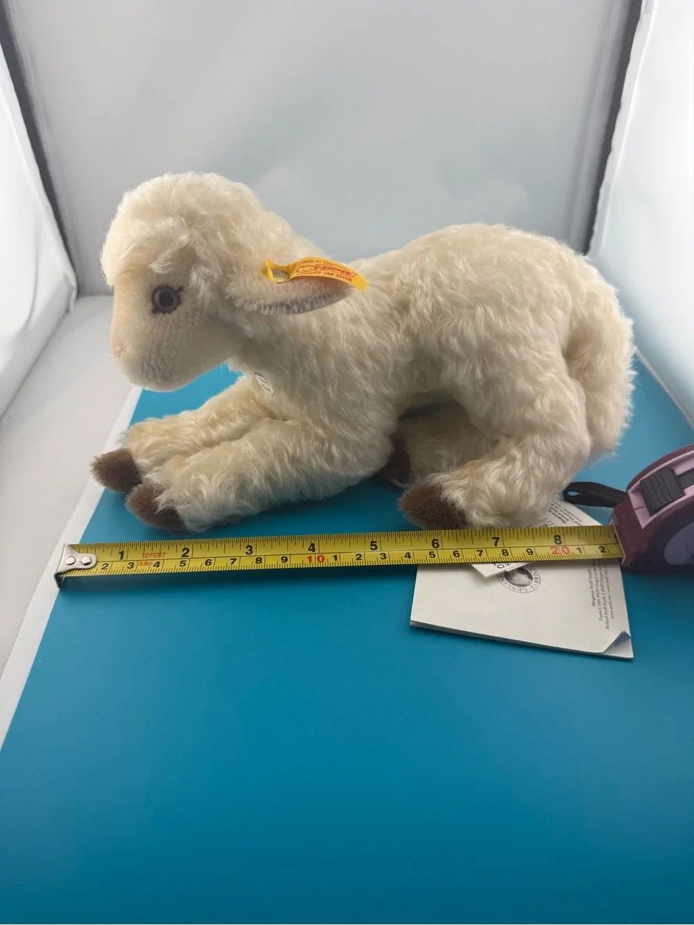 Cream Plush Lamb with Brown Hoof Accents and Yellow Ear Ribbon